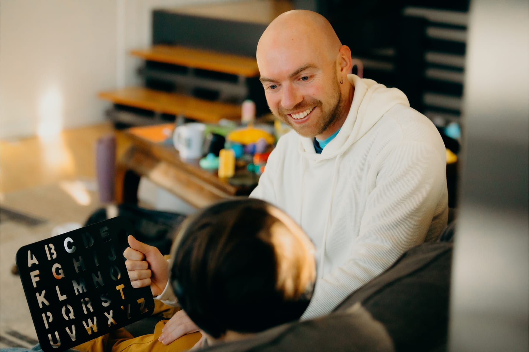 Adam Bates supporting a speller using a letterboard